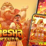 Nikmati keseruan dalam permainan slot online Ganesha Fortune dari PG Soft yang menggunakan tema nuansa spiritual khas India yang menggambarkan kuil megah, diiringi musik tradisional yang menenagkan dengan simbol-simbol yang digunakan seperti: gajah, kitab suci, lentera emas, dan pedeta.